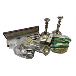 Quantity of plated cutlery, pair of candlesticks, sauce boat and other plated items