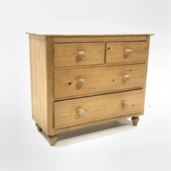 Early 20th century pine chest fitted with two short and two long drawers, raised on turned supports, W107cm, H91cm, D44cm