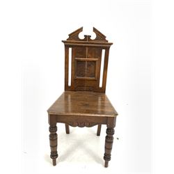 Victorian oak hall chair, broken arch pediment over floral carved panelled back, turned front supports (W43cm) together with a Victorian mahogany prie-dieu with profusely carved fretwork back panel and upholstered in ivory damask (W46cm)