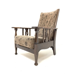 Early 20th century Arts and Crafts oak reclining armchair, with upholstered seat and back, raised on square tapered and shaped supports, W69cm