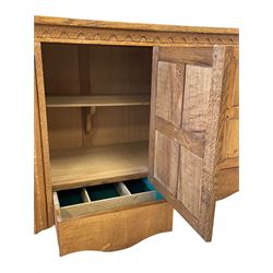'Gnomeman' adzed oak dresser base, rectangular top over three cupboards enclosed by panelled doors each above drawer, carved linen fold uprights, carved with gnome signature, by Thomas Whittaker of Littlebeck, W155cm, H86cm, D44cm