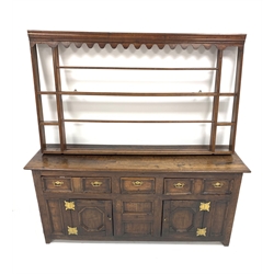 Georgian oak dresser, with two long and one short drawer over two fielded panelled cupboards enclosing a shelf, raised on stile supports, (W180cm, H80cm, D51cm) together with an associated 19th century oak and pine delft rack, (W160cm)