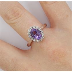 18ct white gold oval amethyst and round brilliant cut diamond cluster ring, hallmarked