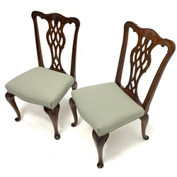 Pair early 20th century Chippendale style mahogany chairs, the shaped cresting rail relief carved with foliage, shaped and pierced splat back, upholstered serpentine seat, acanthus cartouche carved cabriole supports, seat width – 52cm 