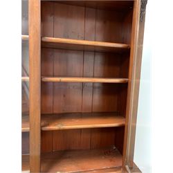 Victorian mahogany bookcase on cupboard, the top section fitted with two glazed doors enclosing three adjustable shelves, two cushion fronted frieze drawers and two panelled doors under, enclosing twelve drawers, raised on plinth base W123cm, H215cm, D53cm