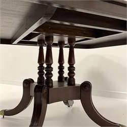  Georgian mahogany breakfast table, the top with ebonised stringing, raised on four turned columns and four splayed supports terminating in brass cup castors, 155cm x 126cm, H76cm  