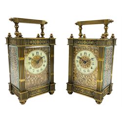French - Pair of Edwardian 8-day timepiece carriage clocks with bevelled rectangular glass panels and overlaid friezes in gilt repousse work with fretted dial masks, enamel chapter ring with Arabic numerals and steel spade hands, both clocks with single train movements, one movement with a jewelled cylinder platform escapement and the other with a jewelled and silvered lever platform escapement.
No Keys.