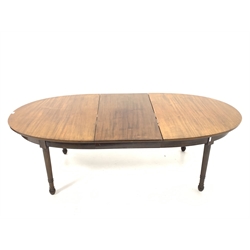 Edwardian mahogany oval extending dining table, raised on ring turned, tapered, fluted and reeded supports, with one additional leaf, wind out mechanism stamped 'Joseph Fitter, Britannia works'