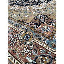 Persian Mashhad blue ground rug, centred by a double medallion and bordered 197cm x 305cm 
500 per inch 