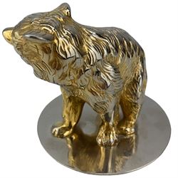 Asprey gilt metal paperweight in the form of a bear on a white metal base inscribed 'Asprey' H9cm