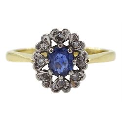 Gold oval sapphire and diamond cluster ring, stamped 18ct Plat
