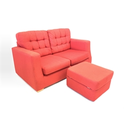 Contemporary two seat sofa, upholstered in red linen, with buttoned loose cushions, raised on beech block supports, together with a matching ottoman