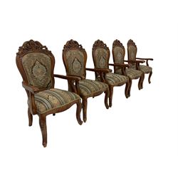 Set ten French style cherry wood dining elbow chairs, pierced pediments decorated with flower heads and c-scrolls, upholstered in floral pattern fabric, cabriole supports carved with flower heads