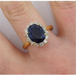 18ct gold oval sapphire and round brilliant cut diamond cluster ring, hallmarked sapphire approx 2.50 carat, total diamond weight approx 0.50 carat