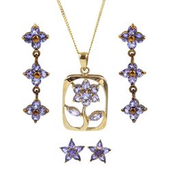 Two pairs of gold tanzanite flower stud earrings and a gold tanzanite flower pendant necklace all 9ct