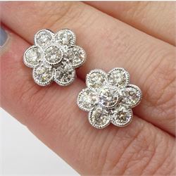 Pair of 18ct white gold round brilliant cut diamond, flower head cluster stud earrings