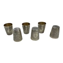 Set of six Victorian engraved silver tumbler cups with oval cartouches and gilded interiors, each H7cm in original case Sheffield 1876 Maker Henry Wilkinson & Co 12oz 