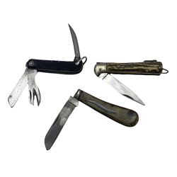 World War II pocket knife by H M Slater with single edge blade, can opener and spike and black chequered grip, the blade inscribed 'Venture 1943', another with antler handle, the locking blade inscribed 'Whitby' and another by Harrison Bros. and Howson with horn grip (3) 