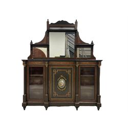 Late 19th century inlaid ebonised mirror back sideboard, the amboyna bordered with ebony and boxwood stringing, the shaped pediment pierced and flanked by finials over three graduating mirrors topped with shelves, the lower section with marquetry design rinceaux patterns, fitted with central panelled cupboard with inset Sevres design porcelain panel, surrounded by gilt metal mounts in garland and ribbon decoration, the door inlaid with geometric walnut banding, two glazed doors to either side, each flanked by columns with gilt metal Corinthian capitals and egg and dart bases, raised on tapered bun feet