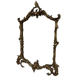 Ornate gilt wall mirror, the frame decorated with shells and c-scrolls, plain mirror plate