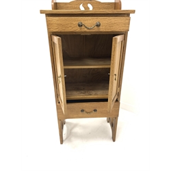 Arts and Crafts style light oak wash stand cabinet, with raised back over two drawers and a cupboard enclosing fixed shelf, raised on peirced panel end supports, W55cm, H150cm, D37cm