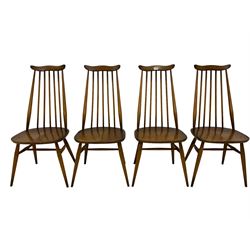 Ercol - set four mid-20th century beech and elm 'Goldsmith's Windsor Dining Chairs', yoke top over high spindle back, raised on tapering supports with H-stretcher
