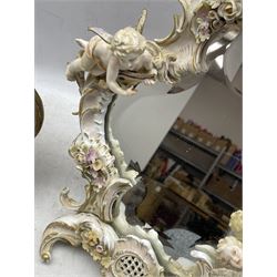 19th century Continental porcelain dressing table mirror decorated with Putti and flowers (a/f) together with a Venetian style giltwood easel mirror (2)