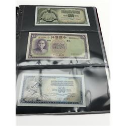 World banknotes including Bank of China five Yuan 1937 'BK268410', The United States of America one Dollar and five Dollars banknotes, British Armed Forces vouchers etc, housed in an album