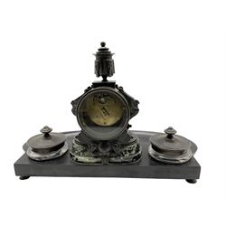 French - 8-day Edwardian clock companion in a bronze and Belguim slate case, French Egyptian revival style c1910, with an ovoid slate base and two recessed clear glass ink wells with bronze caps, variegated green marble plinth surmounted by a drum cased clock with bronze mounts, candle sconce and removable finial, eight-day French movement with a cylinder platform escapement and conforming slate and variegated marble dial, incised gilt roman numerals and matching trefoil brass hands.