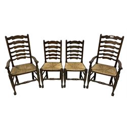 Set of eight (6+2) early 20th century stained beech dining chairs, high shaped ladder back over rush seats, on turned supports with pad feet united by swell-turned stretcher