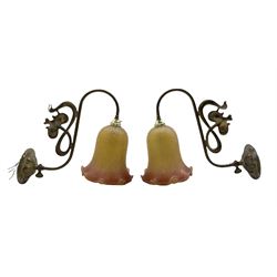 Pair of Art Nouveau brass wall lights circa 1907, of typical stylized form, with associated mottled glass shades, impressed Rd number D29cm x H32cm approx
