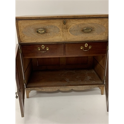 Early 19th century mahogany secretaire chest with fall front writing drawer, cupboards under on splay supports W108cm