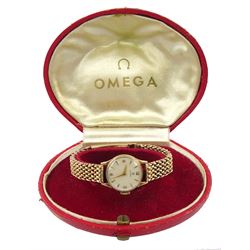 Omega ladies 9ct gold manual wind wristwatch, silvered dial with Arabic and dagger hour batons, Birmingham 1957, on 9ct gold bracelet, with fold-over clasp. hallmarked