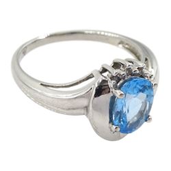 9ct white gold oval blue topaz ring, with five diamond accents, hallmarked 