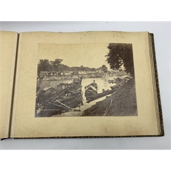 Album containing approximately fifty albumen prints of India, with 'Bourne & Shepherd, Calcutta, Simla & Bombay' purple stamp to the inside, initialled monogram cartouche and gilt border decoration to the front