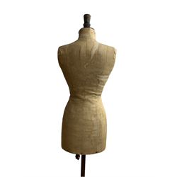 Early 20th century female torso dressmakers dummy or mannequin by R D Franks Ltd, Market Place, Oxford Circus, London W1, no. 38, of cloth construction with iron tripod base, H148cm x W37cm 