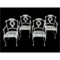Set four cast aluminium garden armchairs, white painted and decorated with  scrolled foliate and berries, raised on slender shaped supports W51cm