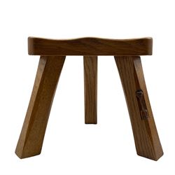 'Catman' oak three-legged milking stool, D-shaped seat with wedged joints, carved with long-necked cat signature, by Chris Checkfield of Whitby 