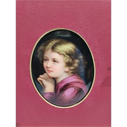 Continental oval porcelain plaque painted with a head and shoulders portrait of a child and inscribed in pencil to the reverse in a gilt frame 12cm x 9cm