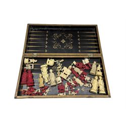 Chinese lacquer folding games box, the interior with backgammon board and containing various Chinese and Indian ivory chess pieces (approx 40) 