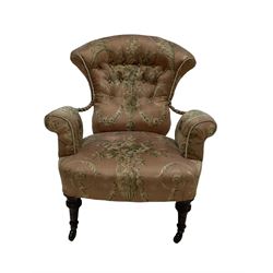 Victorian fan back armchair, upholstered in pink floral fabric, raised on turned supports 