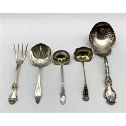 American sterling silver serving spoon by Whiting & Co with shell finial, engraved and pierced stem, two sterling sauce ladles, sterling serving with pierced blade inscribed 'Wells and Cunde' and a serving fork 9.9oz