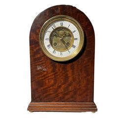 French - 8-day mantle clock in mahogany case circa 1900, with a round top and moulded plinth raised on ball feet, two-part dial with an enamel chapter and gilt centre, visible brocot escapement, Roman numerals and steel spade hands within a glazed brass bezel, rack striking movement striking the hours on a coiled going. With pendulum.