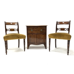 Pair of Regency mahogany frame dining chairs with pierced bar backs and a small 19th century mahogany bow fronted cupboard adapted from a night commode