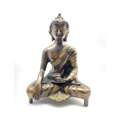 20th century Bronze model of a Buddha with polished highlights, H22.5cm 