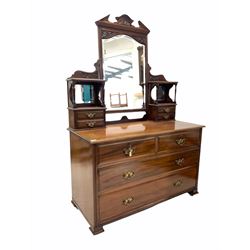 Late Victorian mahogany dressing chest, the raised back with swing mirror and four trinket drawers over two short and two long drawers raised on bracket supports and recessed castors W