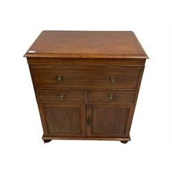 George III mahogany cabinet, rectangular hinged top with moulded edge, fitted with false drawer over two short drawers and two panelled cupboard doors, raised on turned feet