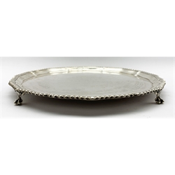 Silver circular salver with gadrooned edge, presentation inscription and on claw and ball feet D31cm London 1937 Maker Robert Pringle & Sons 28.5oz