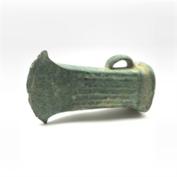 Bronze Age axe head with short curved blade and ribbed design with projecting loop handle L9cm
