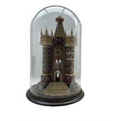 Edwardian velvet and beadwork model of a Church tower dated 1910, set with three dials and arched mirrored windows and doors, housed under a circular glass dome on ebonised base, H67cm overall